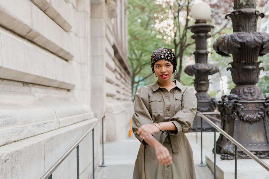 Stylish woman in a city street, blending fashion and culture with elegance.